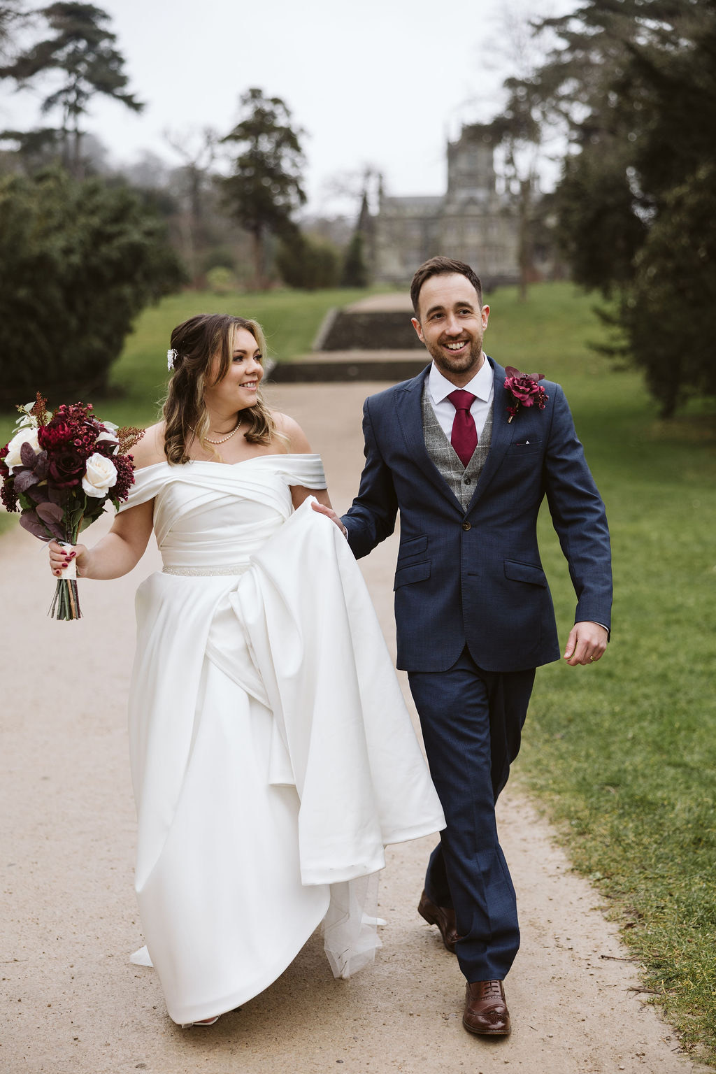 Codey and Darren in the grounds of a country house on their wedding day