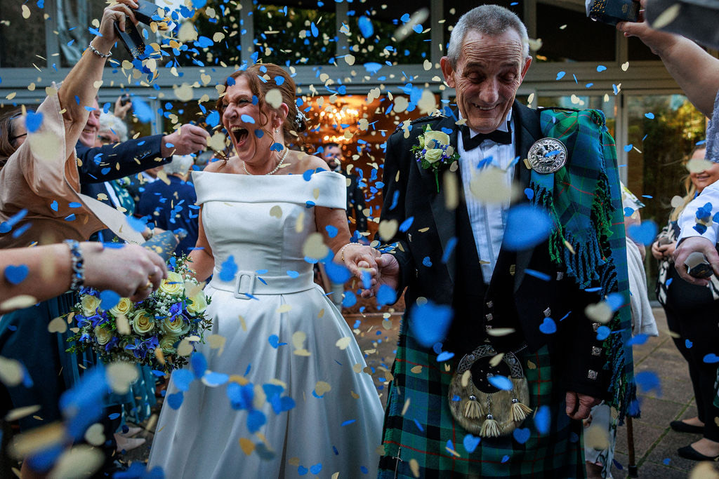 Confetti thrown over a couple